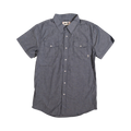 Glas Apparel Protrero short sleeve button-down shirt in blue chambray with dual chest pockets on wood floor